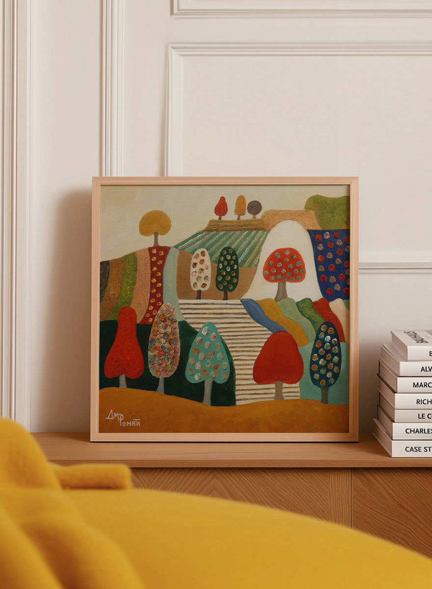 A framed abstract landscape painting featuring stylized trees, hills, and geometric shapes in red, blue, green, yellow, beige, and brown tones. Shop Whimsical Tree Landscape by Angeles M. Pomata, a colorful landscape art print featuring patterned trees, patchwork hills, and warm autumn tones.