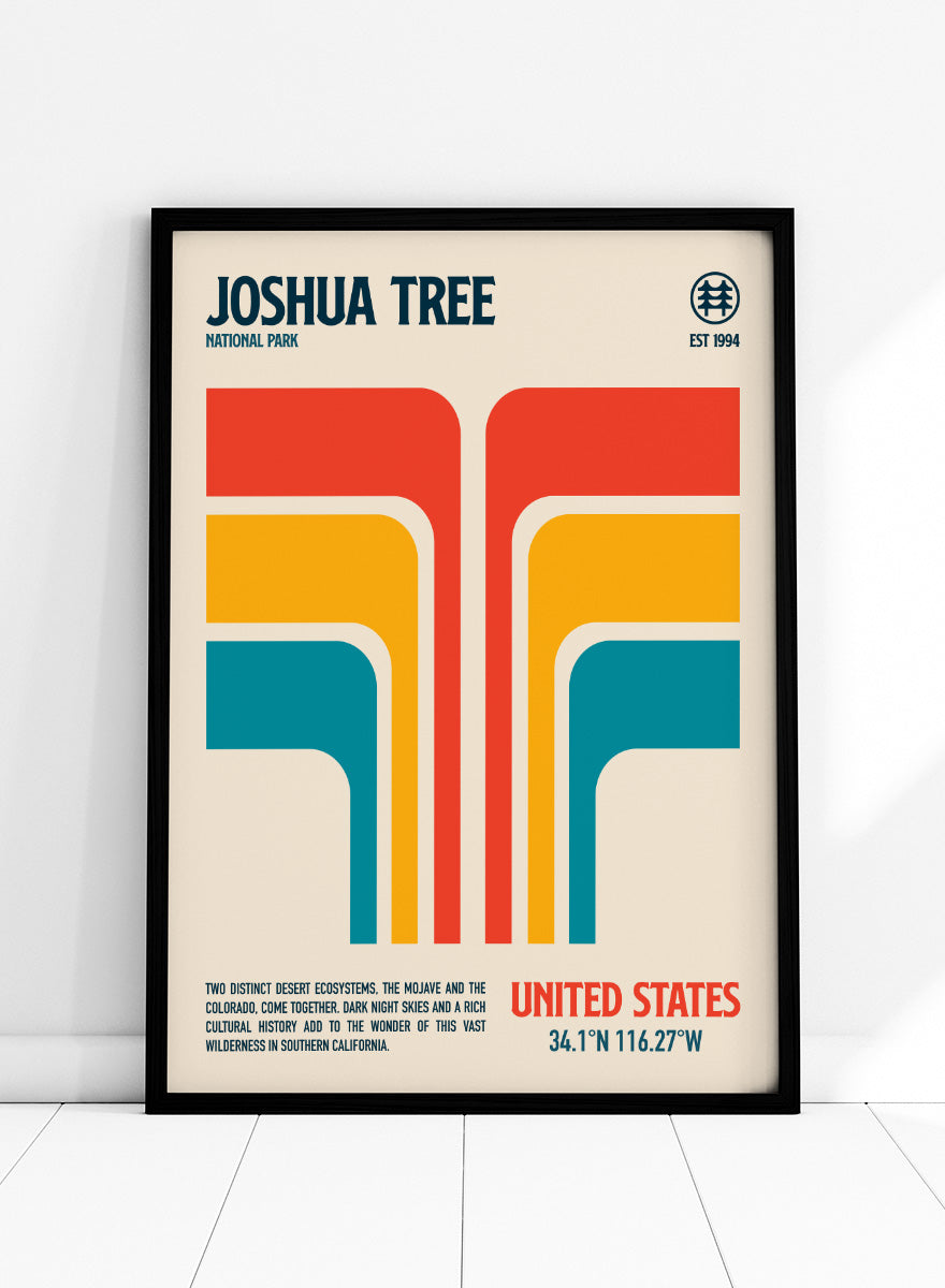 A retro-style poster for Joshua Tree National Park with bold geometric shapes in red, orange, yellow, and teal on a cream background, plus text reading 'Joshua Tree National Park' and 'United States' with coordinates. Joshua Tree Retro Desert by Retrodrome travel art print featuring bold desert stripes, retro color, and a modern Joshua Tree National Park design.