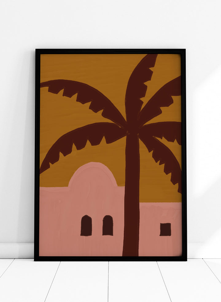 A stylized painting of a palm tree in front of a pink building under a mustard yellow sky. Desert Palm Abode by The Art Concept art print featuring a pink desert home, oversized palm tree, ochre sky, and warm retro color palette.