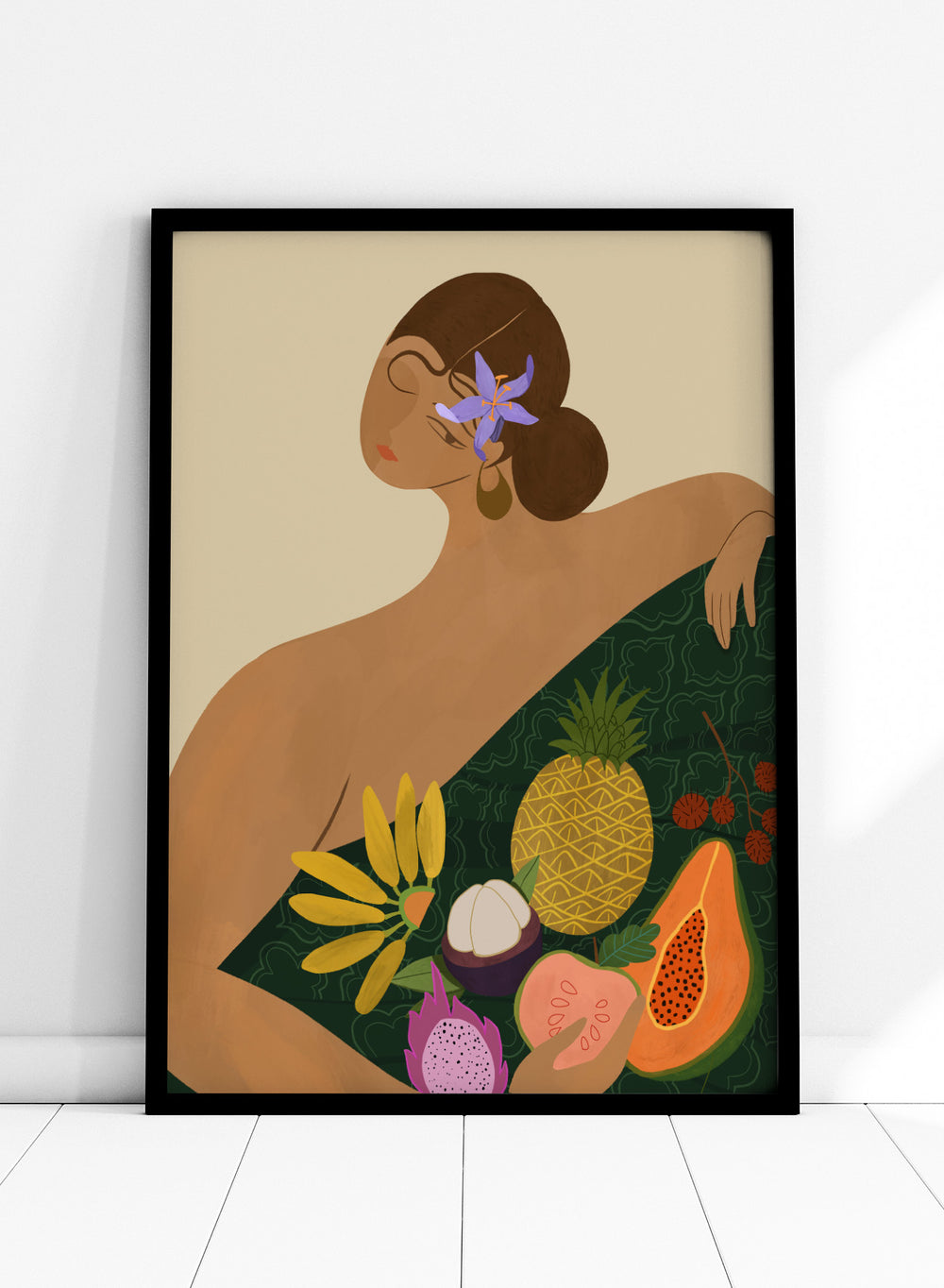 Illustration of a woman with a green wrap featuring tropical fruits on a beige background. Fruit Seller by Arty Guava is a colorful tropical art print featuring exotic fruit, expressive female figures, bold color, and contemporary illustration.