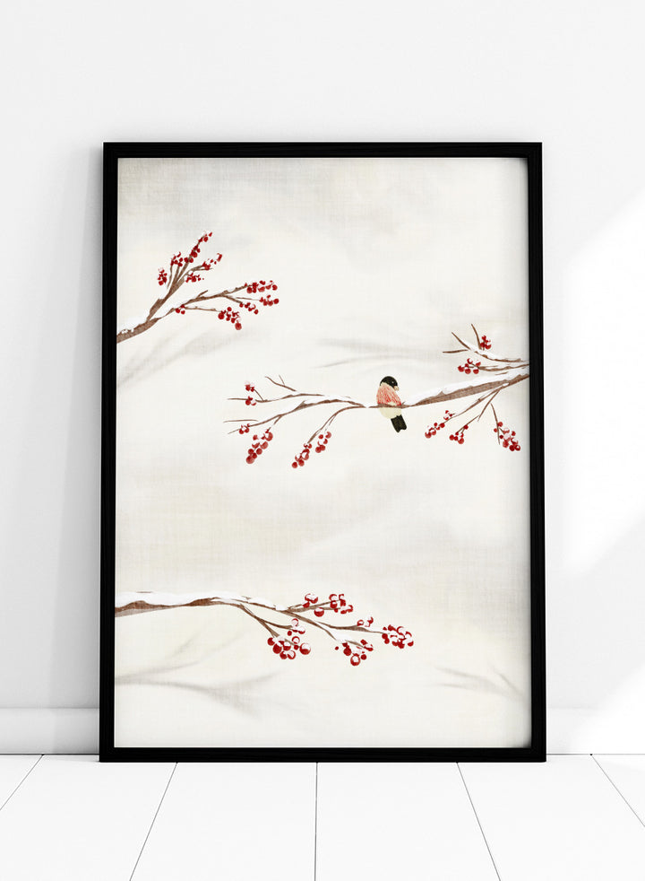 Shop Winter Bird With Berries by Nikita Jariwala, a winter bird wall art poster print featuring snowy branches, red berries, soft neutrals, and delicate seasonal detail.