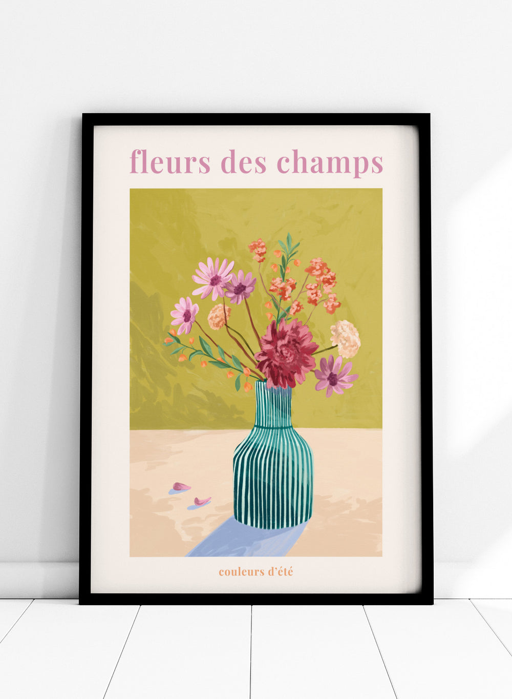 Illustration of a vase with flowers on a green background, featuring the text 'fleurs des champs' and 'couleurs d'ete'. Fleur Des Champs Green by Goed Blauw is a colorful floral art print and wall poster featuring a striped vase with loose flowers on a warm yellow background.