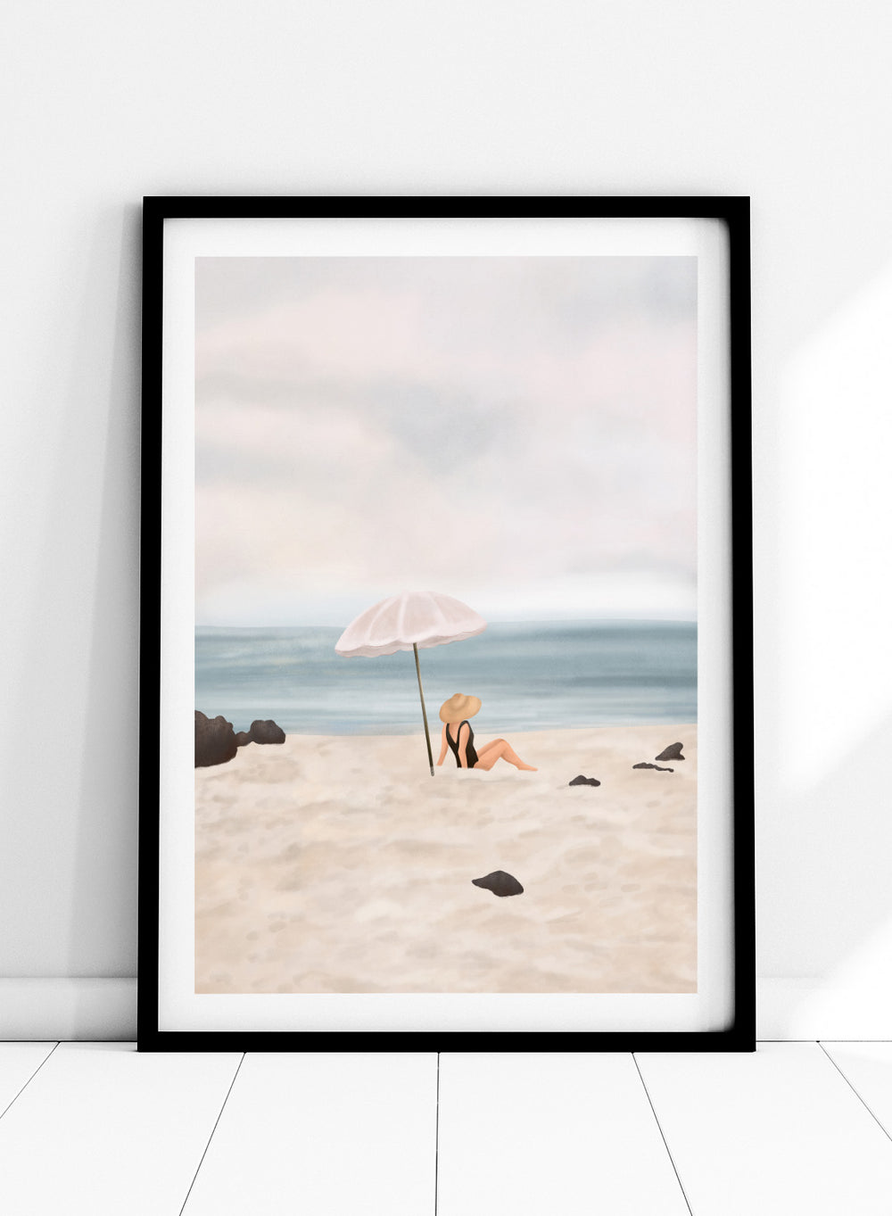 Woman under an umbrella on a beach with a calm ocean and sky. Serene Beach Scene by Flow Line is a coastal art print featuring a woman by the ocean, beach umbrella, seaside illustration, and summer wall art.