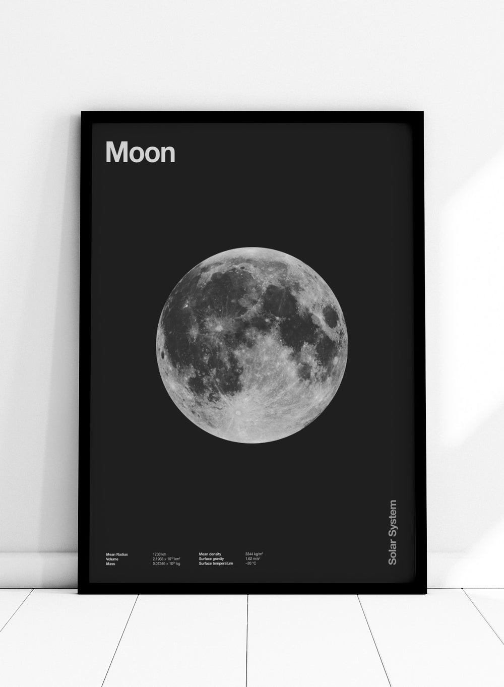 Poster of the moon with 'Moon' text at the top and 'Solar System' text at the bottom. The Full Moon by Florent Bodart is a minimalist space art print with detailed lunar surface, a modern black wall poster inspired by astronomy and science design.