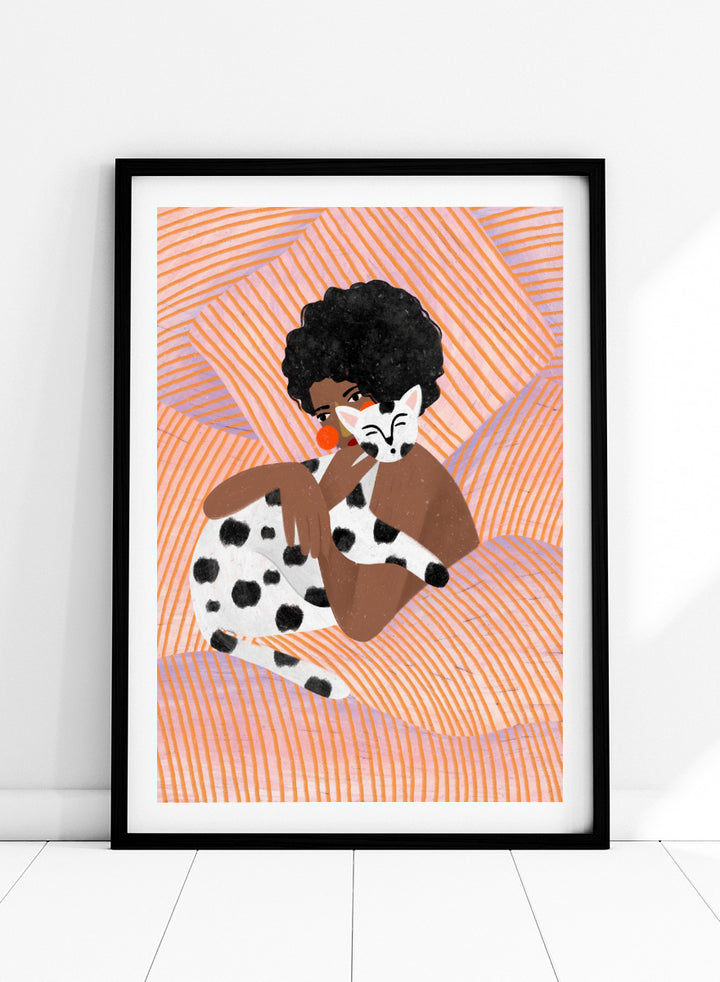 A framed art print featuring a stylized illustration of a person with an afro holding a black-and-white spotted cat, set against a peach and orange striped background. Cozy Cat Cuddles by Bea Müller animal art print featuring a woman embracing a spotted cat among soft peach and lilac stripes for cozy pet lover decor.