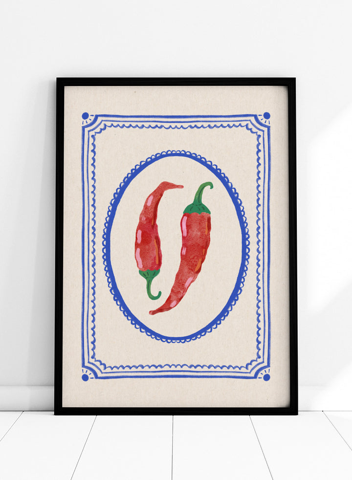 Spicy Chili Peppers by Katarzyna Gąsiorowska kitchen art print featuring red chilies in an ornate cobalt frame with vintage Mediterranean style.