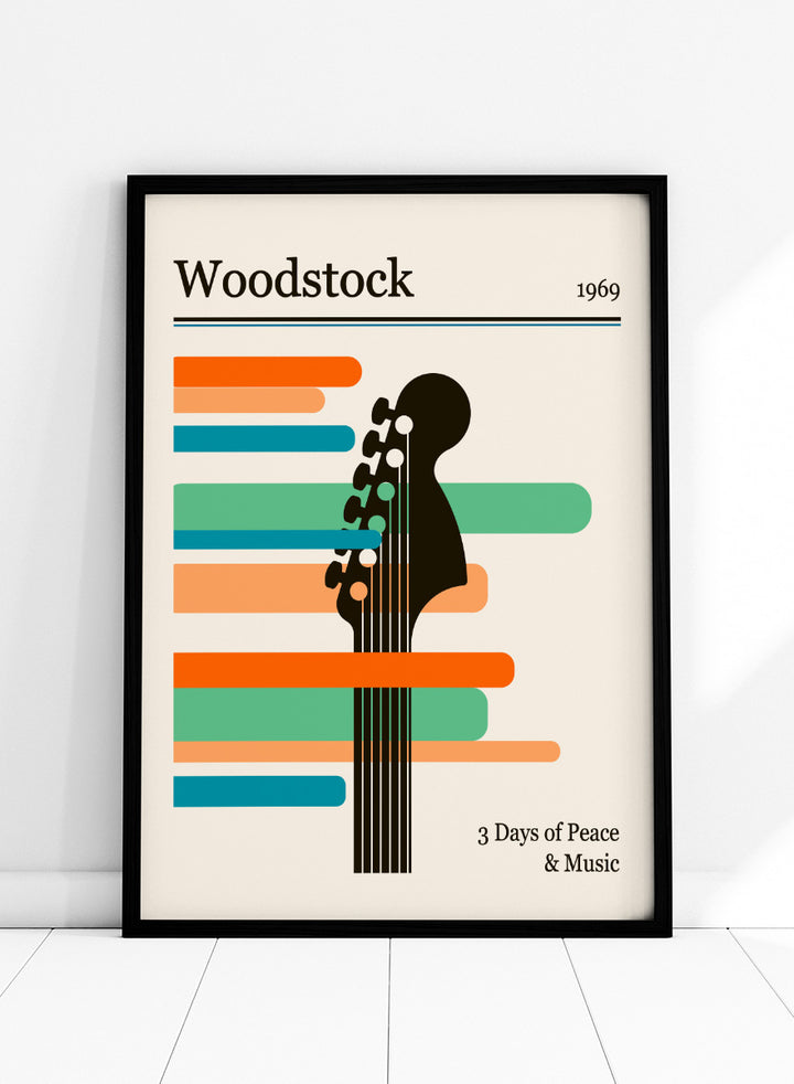 A graphic poster-style design for Woodstock 1969, featuring a black guitar headstock silhouette layered over horizontal orange, teal, and blue bars on a warm cream background. The text reads &