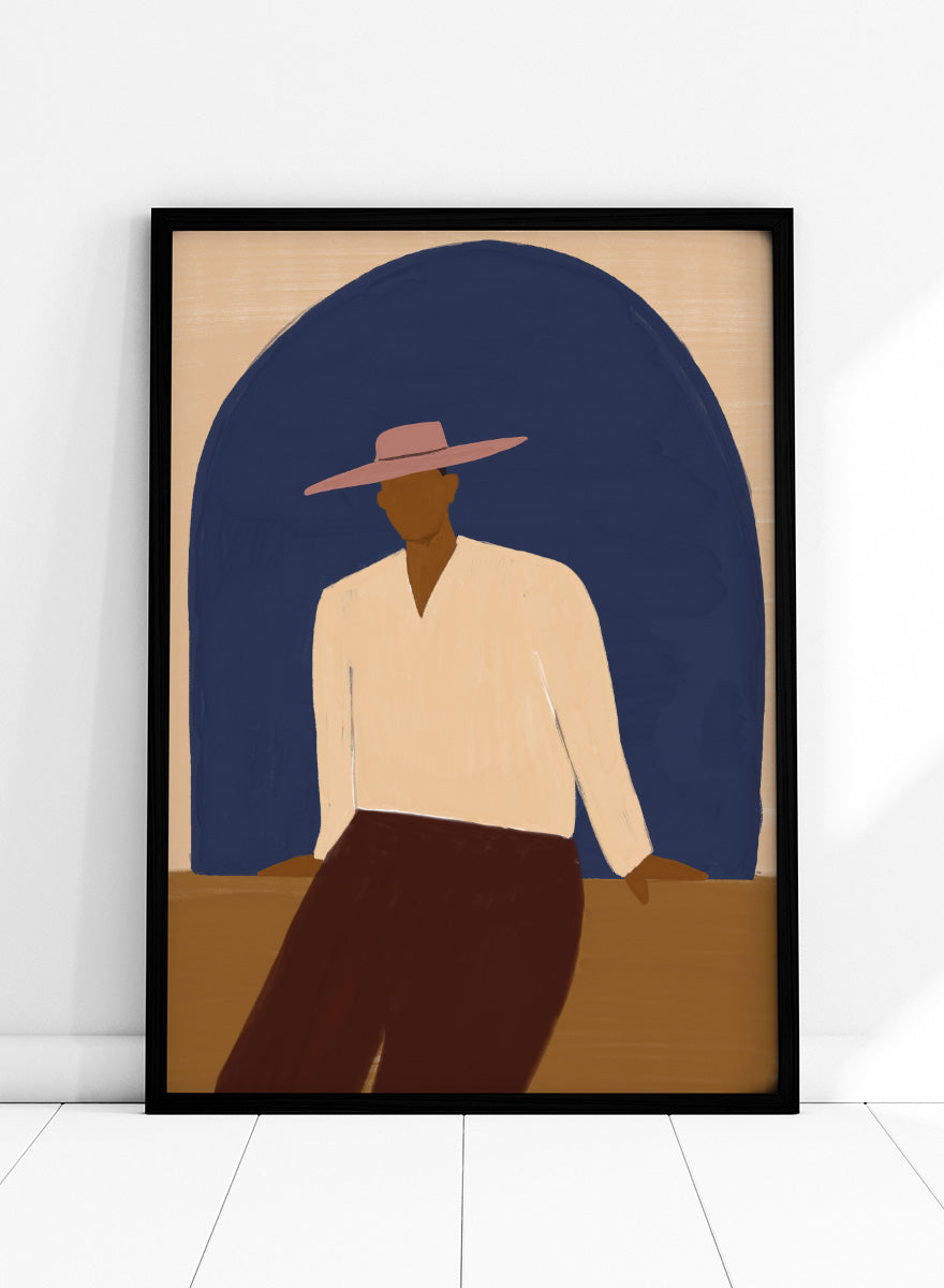 A stylized art print depicting a seated figure in a wide-brimmed pink hat, cream shirt, and dark brown trousers against a large dark blue arch on a beige background. Man In Blue Arch by The Art Concept portrait art print featuring a lone figure beneath a deep blue arch in warm earthy tones.