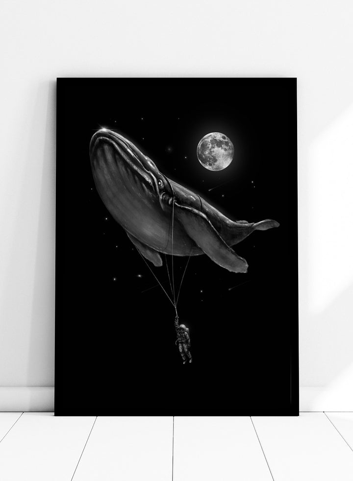 Black and white illustration of a large whale balloon with a person attached, set against a starry night sky with a moon. Cosmic Whale Ride by Nicebleed is a surreal space art print featuring an astronaut hanging from a floating whale, modern aesthetic wall poster.