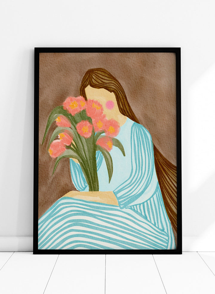 A stylized art print depicting a woman with long brown hair in a light blue striped dress holding a bouquet of pink tulips, set against a textured brown background. Shy Woman Pink Tulips by Nikita Jariwala, a figurative wall art print poster with pink tulips, blue dress illustration, and romantic floral decor.