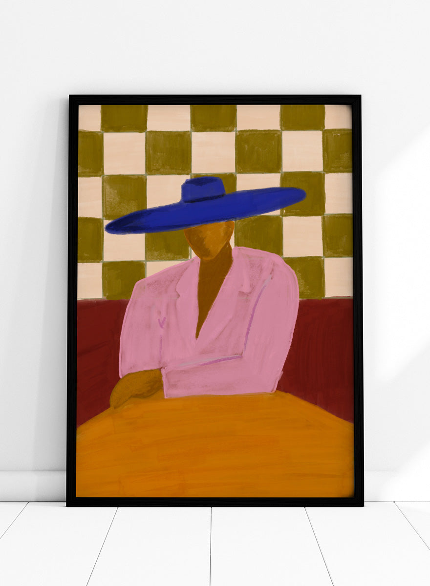 A stylized painting of a seated figure wearing a wide blue hat and pink top, with a red couch and a beige-and-olive checkered wall behind them. Blue Hat Chic by The Art Concept portrait art print featuring a cobalt blue hat, pink jacket, checkerboard backdrop, and bold modern color.