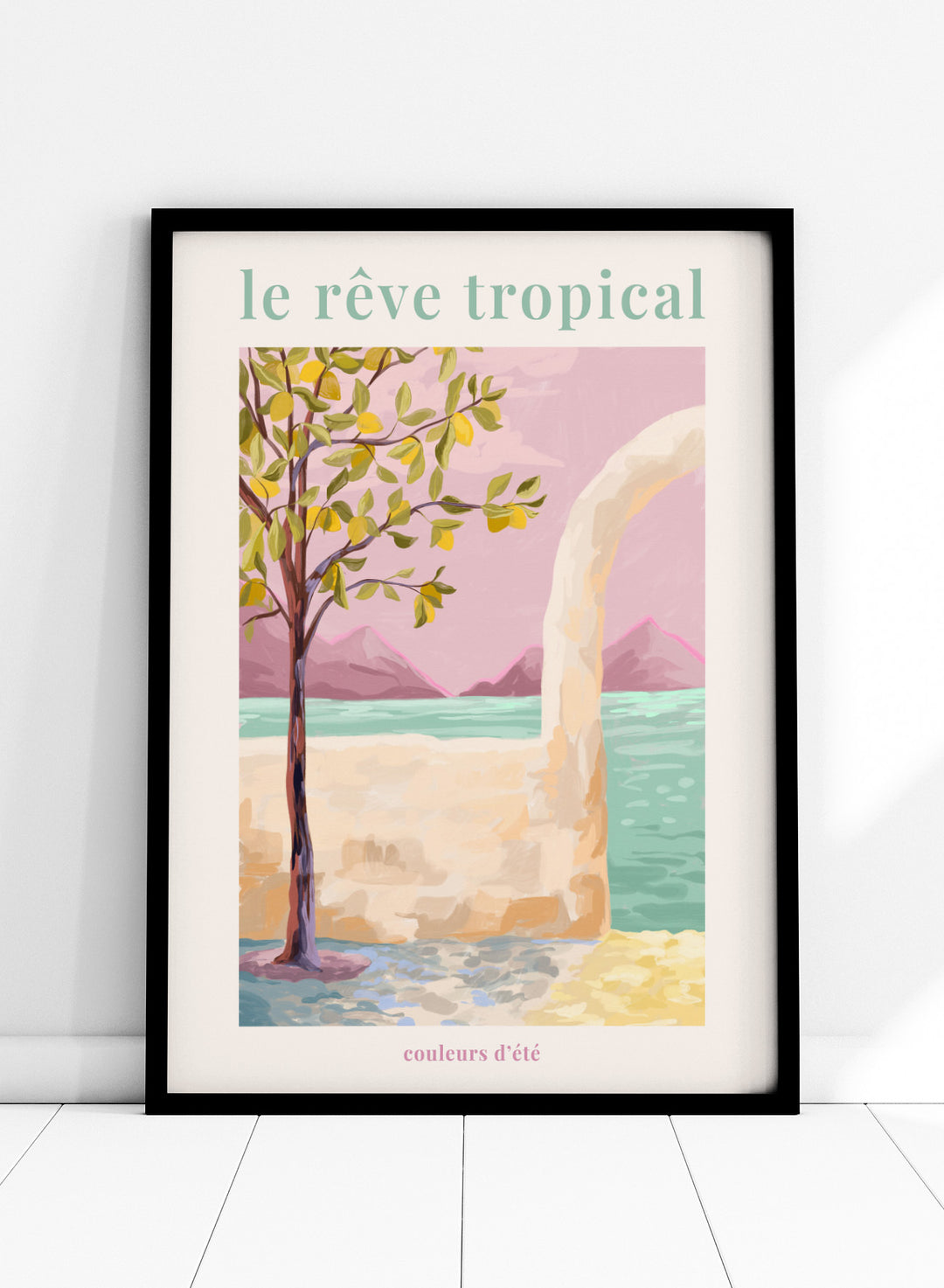 Artistic depiction of a tropical scene with a tree, beach, and mountains, featuring the text 'le rève tropical' and 'couleurs d'été'. Le Rêve Tropical Lemon Tree by Goed Blauw is a coastal art print and wall poster featuring a lemon tree, archway, and ocean view in warm pastel tones.