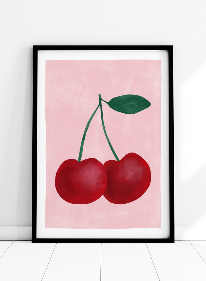 Two red cherries with a green stem on a pink background. Red cherries art print by Elena Ristova featuring two hand-painted cherries with green stems on a soft pink background. Officially licensed minimalist wall poster.