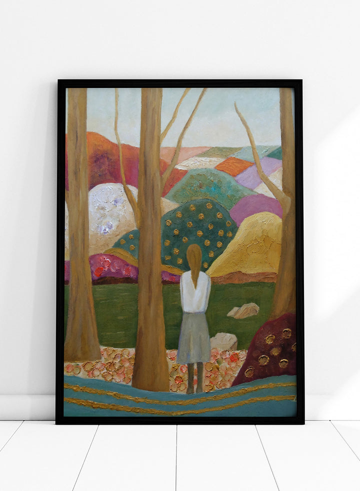 An expressive painting of a woman seen from behind standing among tall trees in a stylized landscape with colorful hills, patches of green, purple, pink, blue, and gold accents. Shop Woman Among Vibrant Hills by Angeles M. Pomata, a colorful landscape and portrait art print featuring a woman, rolling hills, trees, and earthy tones.