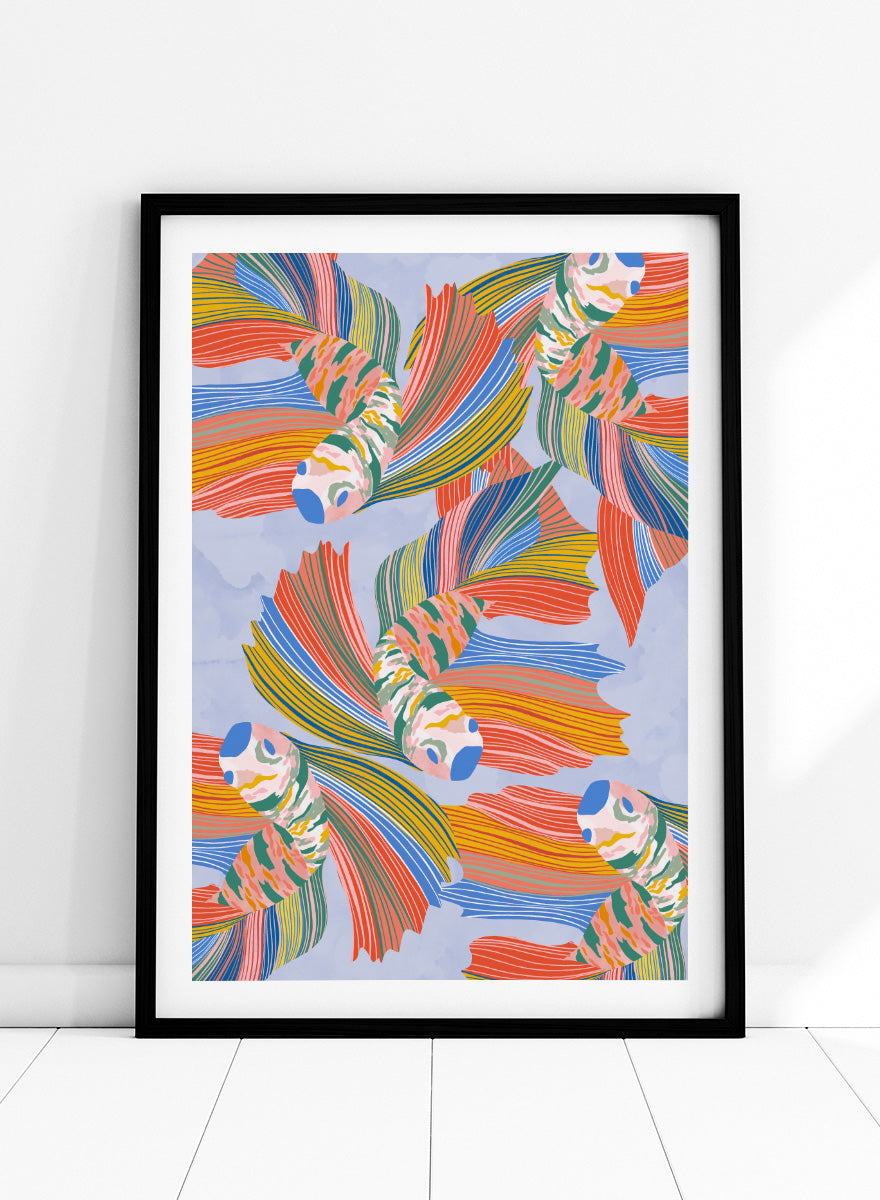 A framed art print featuring a colorful pattern of stylized fish with flowing striped fins in orange, yellow, green, blue, and red on a light blue background. Vibrant Swirling Fish Pattern by Ceyda Alasar art print featuring colorful flowing fish, striped fins, and playful aquatic movement on a soft blue background.