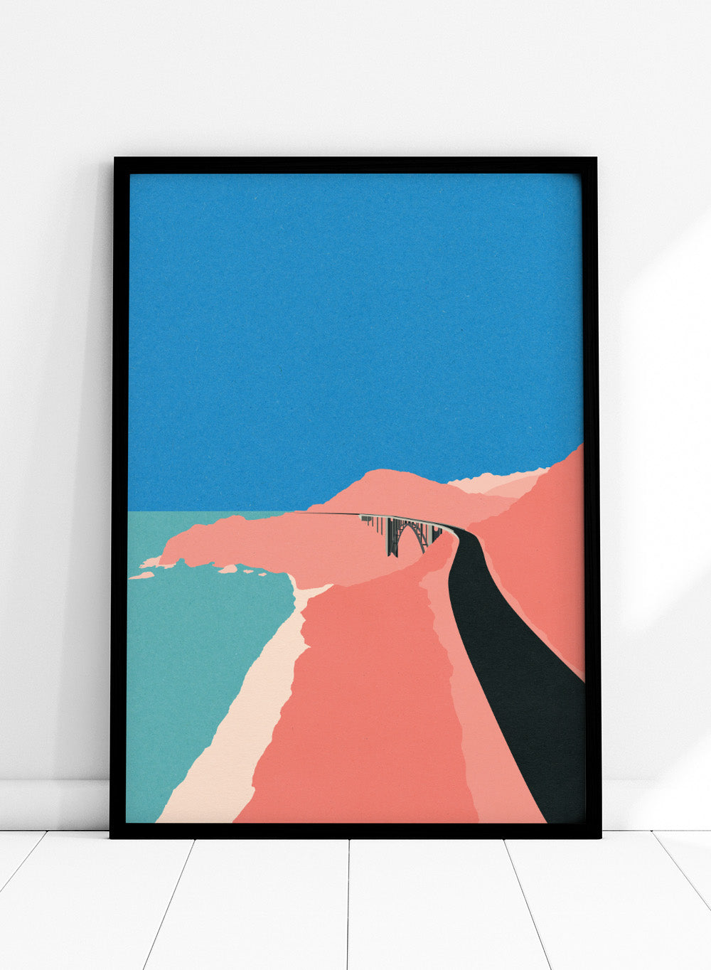 Artistic illustration of a coastal road with cliffs and blue sky. Pacific Coast Highway Big Sur by Rosi Feist is a modern minimalist landscape art print with bold color and Bauhaus-inspired graphic design. Officially licensed fine art poster with framing.