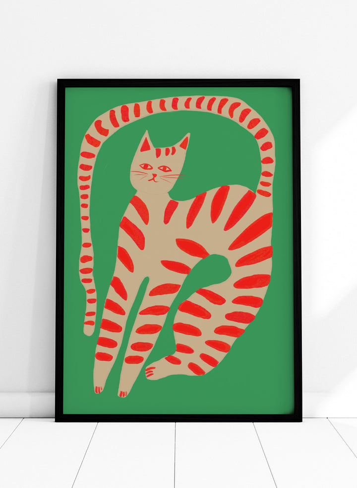 A stylized art print of a cat curled up in a circle, featuring a beige body with red stripes on a solid green background. Striped Cat Stretching by The Art Concept art print featuring a playful striped cat, green background, and bold red accents.