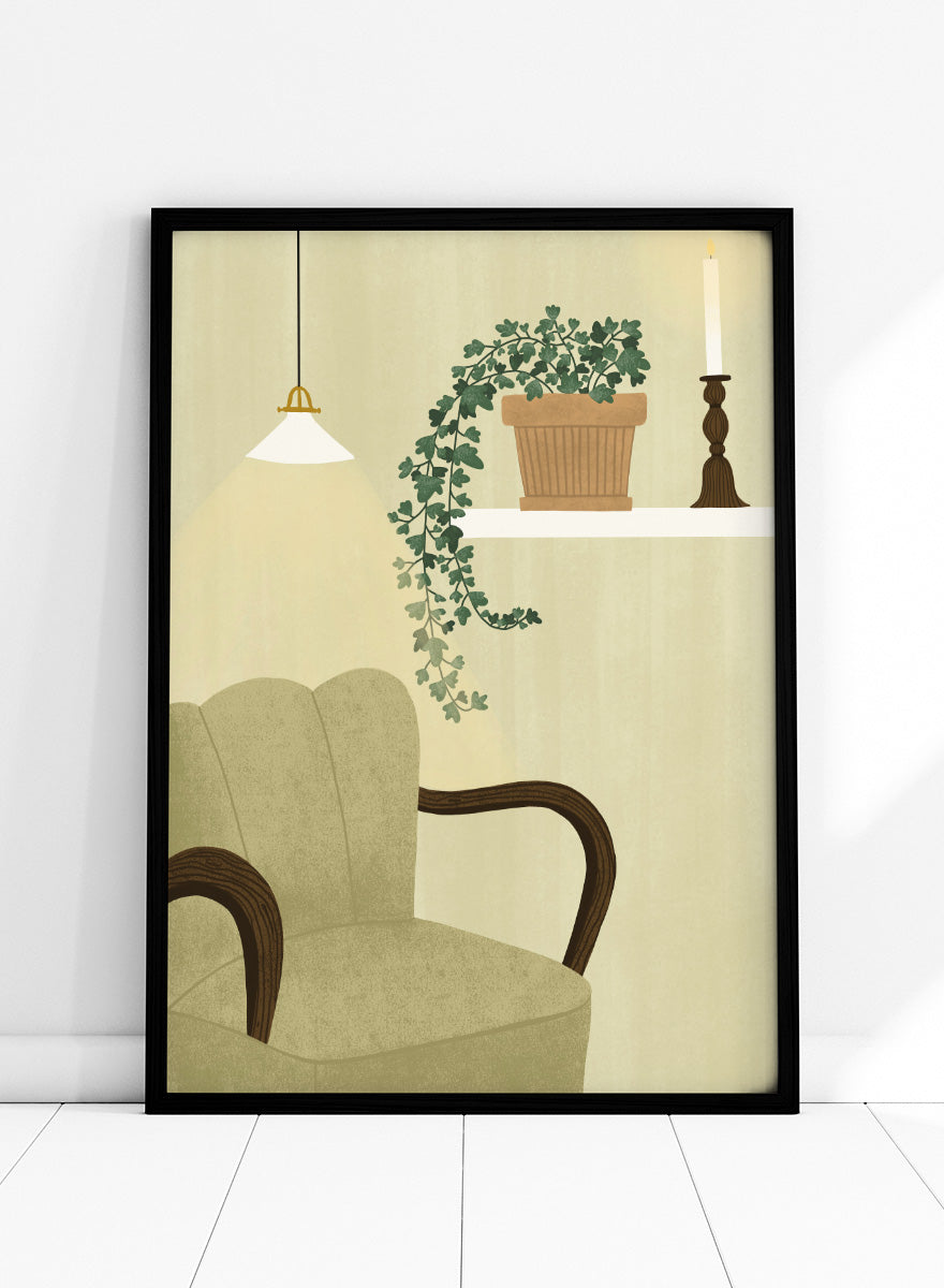 A framed art print featuring a cozy interior scene with a beige armchair, a hanging pendant light, a shelf with a potted trailing green plant and a candlestick, and a cream-colored wall background. Shop Cozy Indoor Retreat by Elsa Nätterdal, a modern interior art print featuring a cozy armchair, trailing houseplant, candlelight, and warm neutral tones.