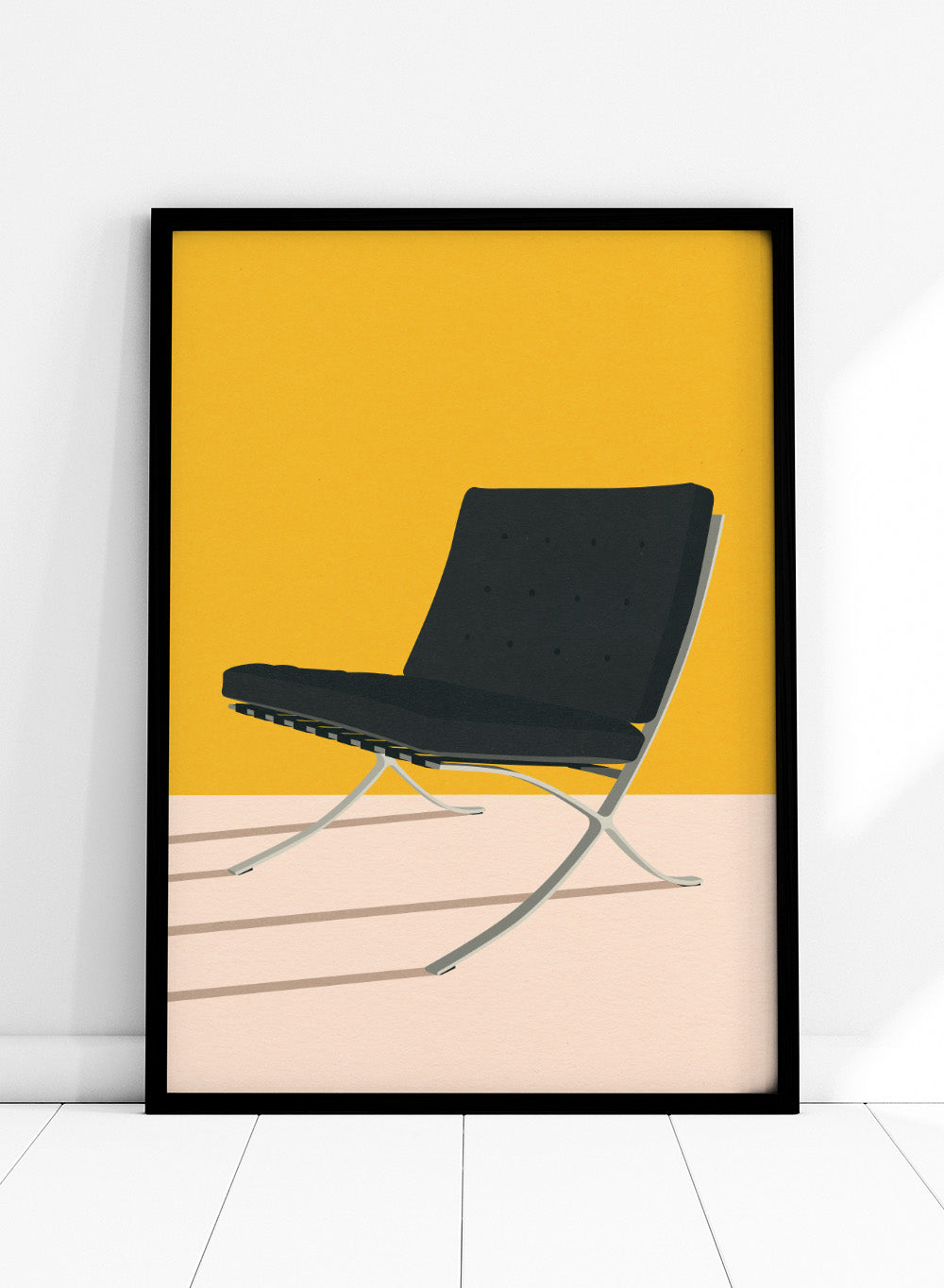 Black chair with metal legs on a yellow and beige background. Barcelona Chair by Mies Van Der Rohe by Rosi Feist is a minimalist modern design art print featuring clean lines and bold color. Officially licensed fine art poster with optional real wood framing, ready to hang.