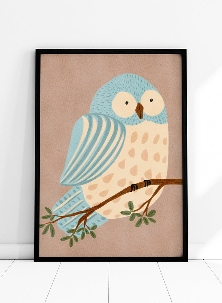 A stylized illustration of a blue and cream owl perched on a brown branch with green leaves, set against a warm beige background. Shop Whimsical Blue Owl by Nikita Jariwala, a blue owl wall art print poster for nursery and kids room decor featuring a playful bird illustration and soft blue tones.