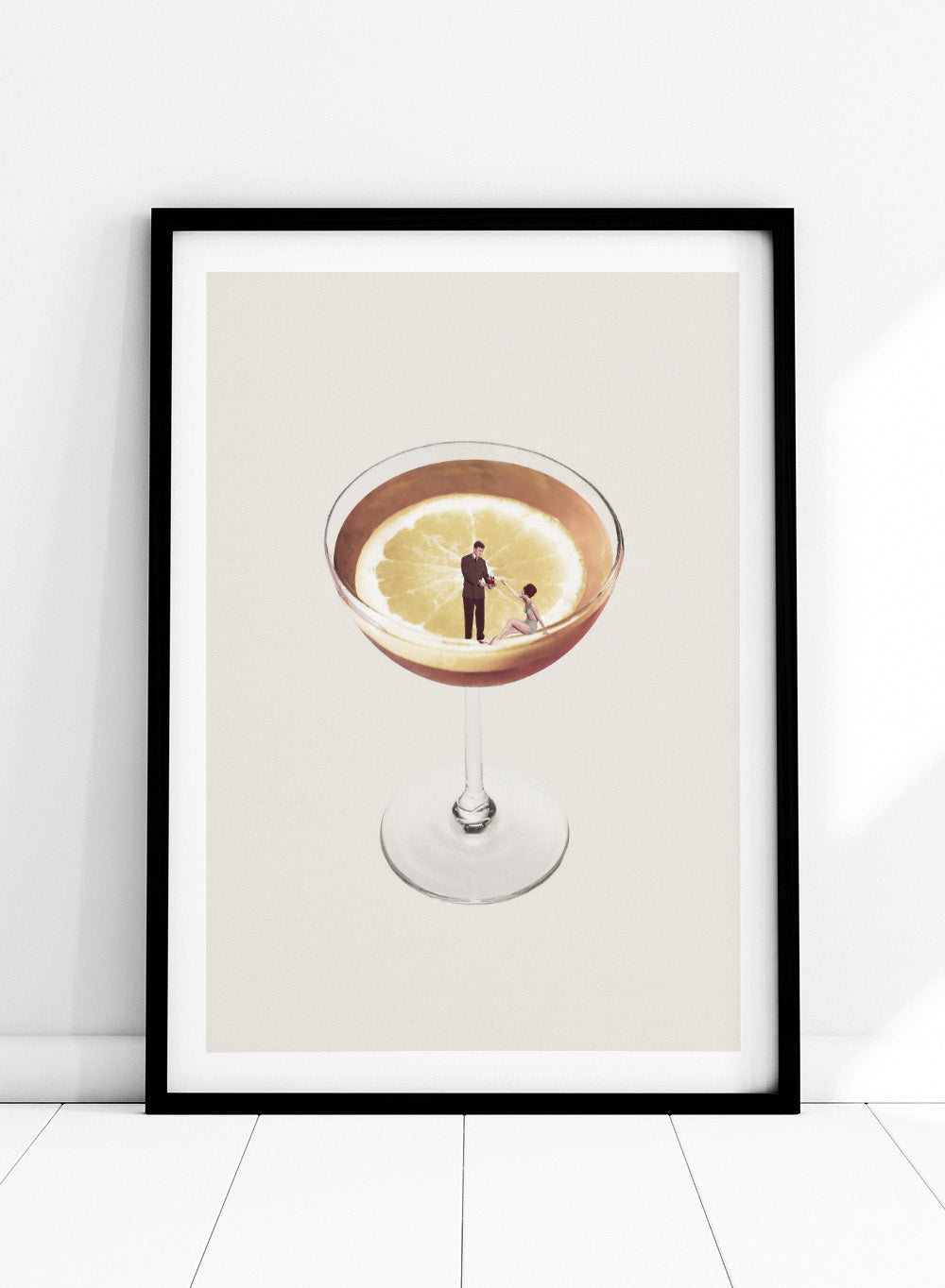 My Drink Needs a Drink by Maarten Léon is a minimalist collage art print featuring a lemon cocktail scene with vintage figures and playful surreal detail.