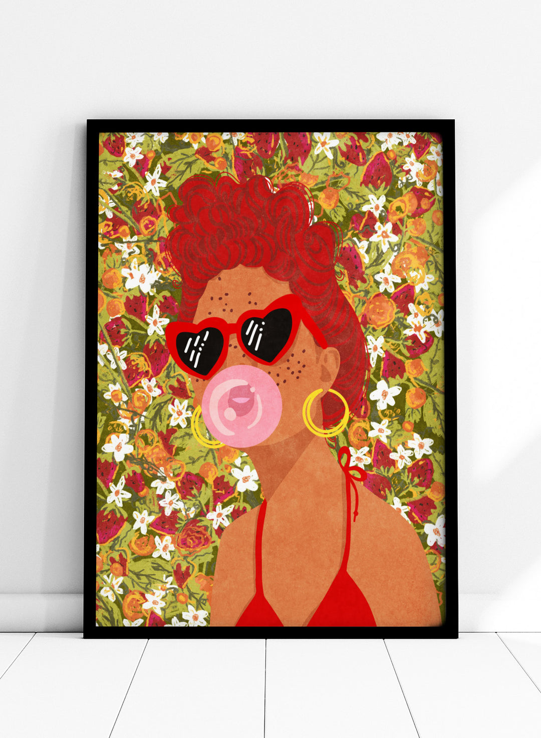 Illustration of a woman with red hair, sunglasses, and a pink bubble gum against a floral background. Strawberry Lady by Raissa Oltmanns fine art print featuring bold female portrait with strawberry background, modern colorful wall decor poster.