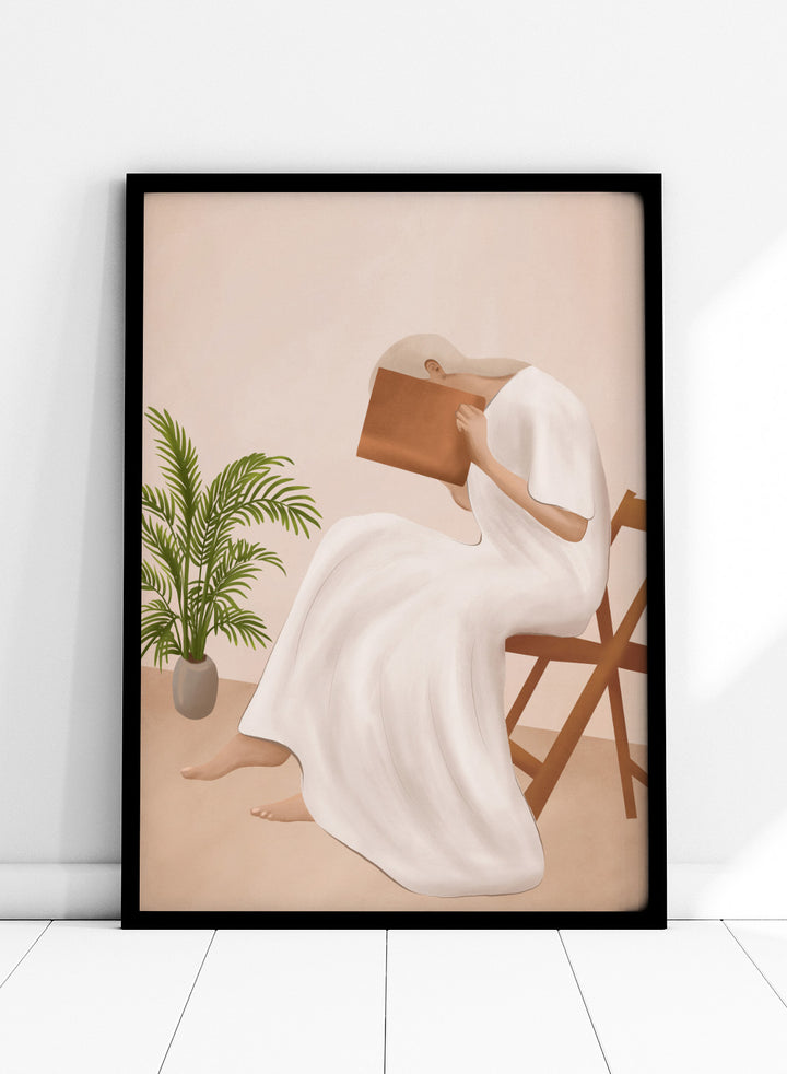 Person in a white dress holding a book, sitting on a chair with a plant nearby. Serene Woman Reading by City Art is a minimalist figurative art print featuring a woman reading in a flowing white dress with warm neutral tones and botanical details.