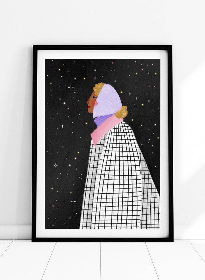 A framed art print featuring a stylized illustration of a woman in profile wearing a white and black checkered cape and a lavender headscarf against a black starry background. Shop Woman Under Starry Night by Bea Müller, a figurative wall art print poster featuring a contemplative woman beneath a star-filled black night sky.
