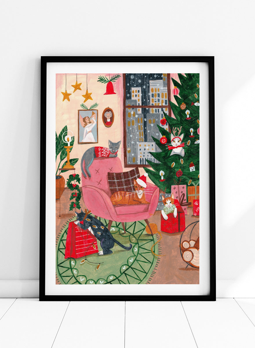 Shop Cats Home for Christmas by Caroline Bonne Müller, a festive cat wall art print poster featuring cats, a Christmas tree, presents, and a colorful holiday interior.