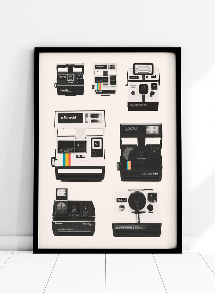 Collection of Polaroid cameras displayed against a white background. Vintage Instant Cameras by Florent Bodart is a retro camera art print featuring classic Polaroid designs, a modern wall poster for photography and design lovers.