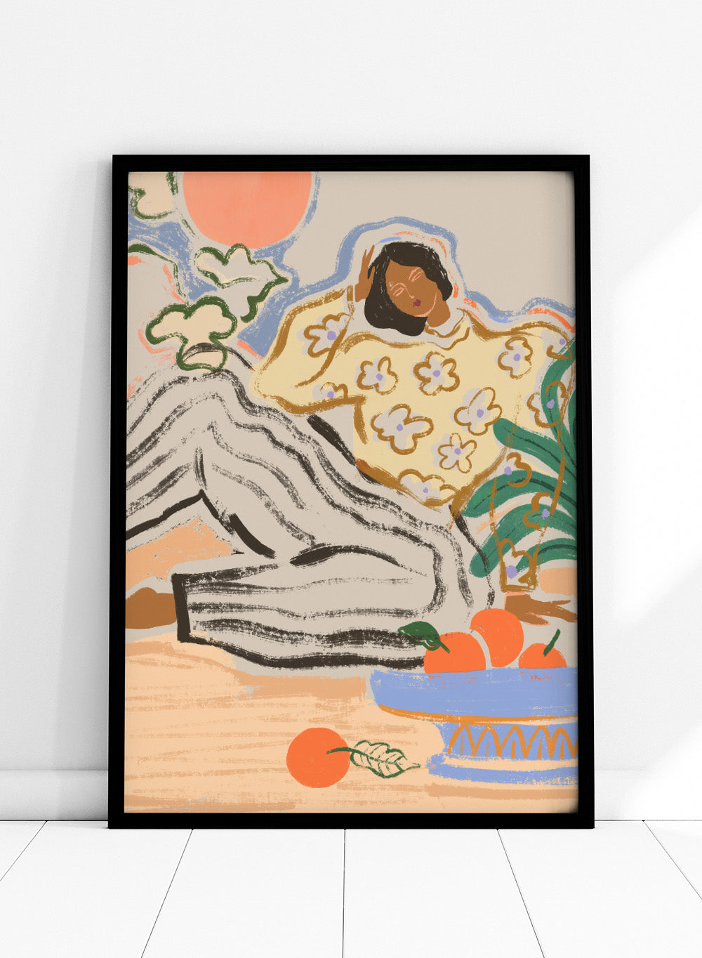Artistic depiction of a person lounging on a beach with a bowl of fruit and flowers. Lazy Days by Arty Guava is a modern woman art print with warm colors, oranges, and relaxed still life details. Officially licensed wall poster.