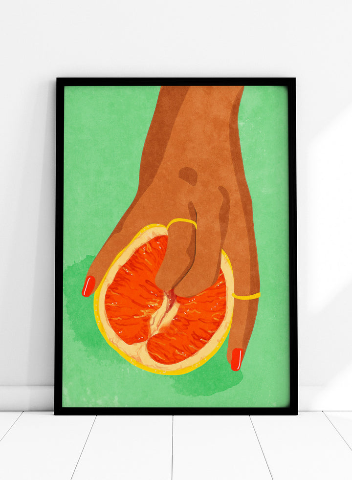 Illustration of a hand holding a sliced orange against a green background. Fruit Lover wall art print by Raissa Oltmanns blends playful citrus and intimate symbolism in a contemporary modern aesthetic poster.