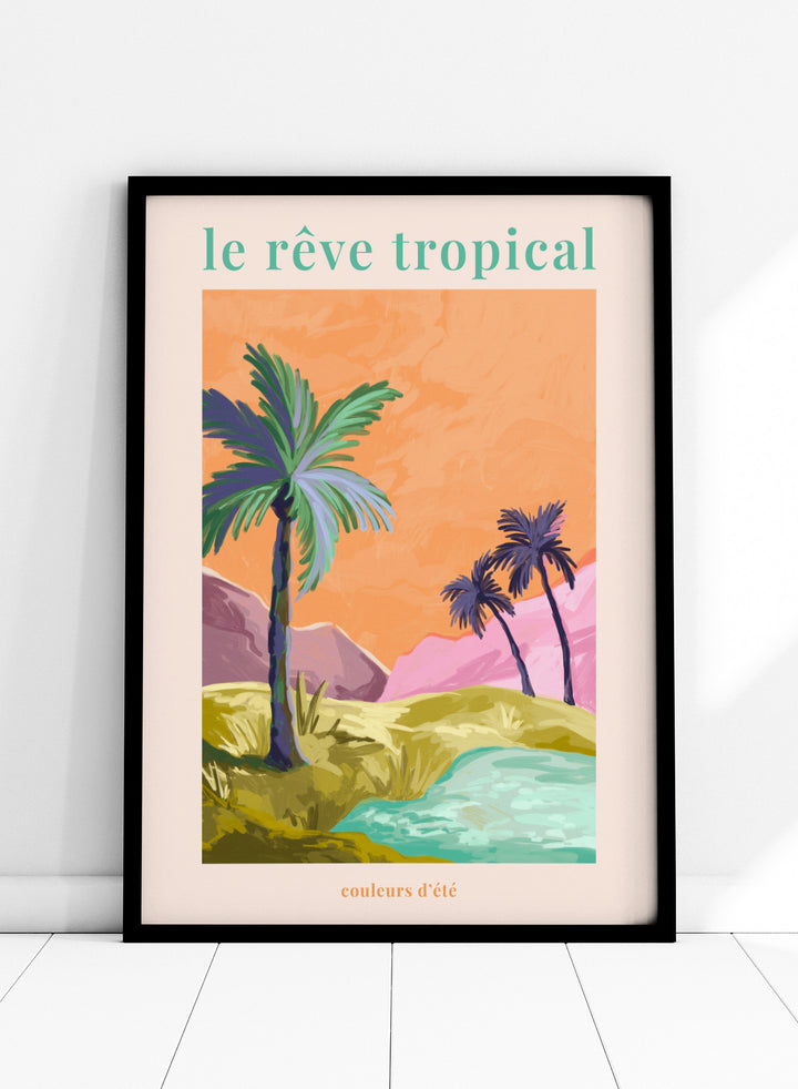 Tropical landscape with palm trees and a lake, featuring the text 'le rève tropical' on an orange background. Le Rêve Tropical Palm Trees by Goed Blauw is a tropical landscape art print and wall poster featuring palm trees, hills, and water in warm sunset tones.