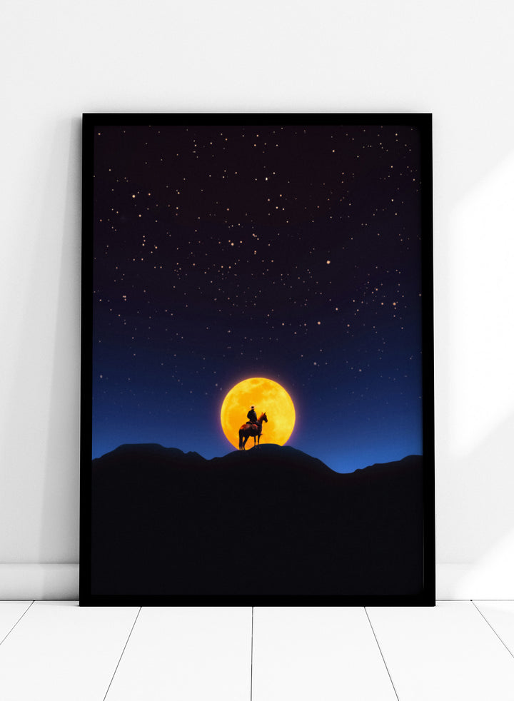 Silhouette of a person on horseback under a large orange moon and starry night sky. The Rider and the Moon by Taudalpoi cowboy moon art print with horse silhouette, starry sky and glowing full moon retro cosmic poster wall art.