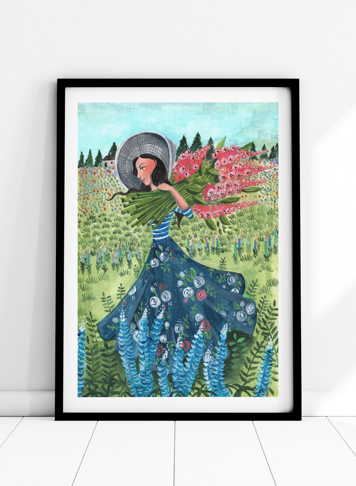 Woman in a floral dress holding flowers in a garden. Woman With Summer Flowers by Caroline Bonne Müller is a fine art print and wall poster featuring a woman carrying flowers through a colorful field.