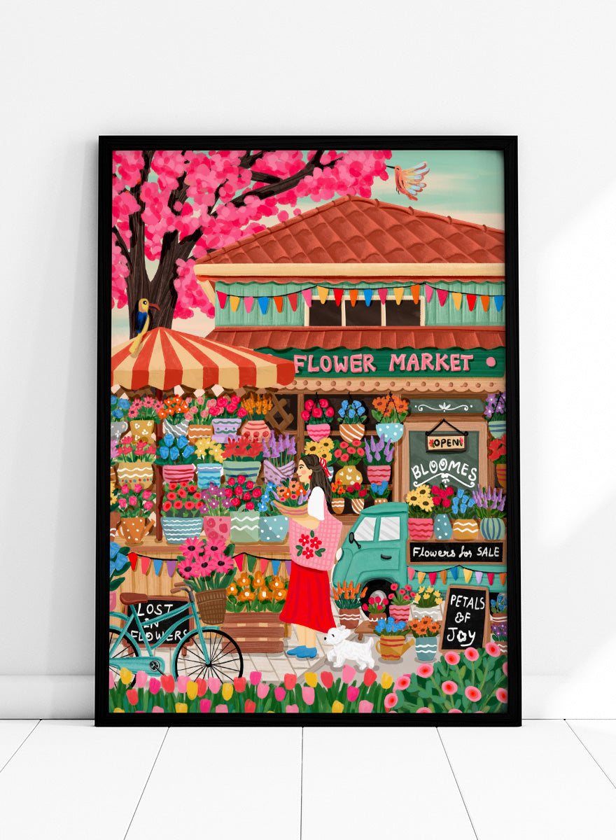 A colorful illustrated flower market scene with a shop front, blooming pink cherry blossoms, flower stalls, a woman standing by a bicycle, and signs reading 'Flower Market', 'Bloomes', and 'Petals of Joy'. Colorful Flower Market Scene by Nidhi Kachhadiya fills the frame with buckets of flowers, patterned pots, striped awnings, hand-painted signs, and a shopper carrying a fresh bouquet through the middle of it all. A bicycle, tiny flower truck, and little white dog add even more character around the edges. I