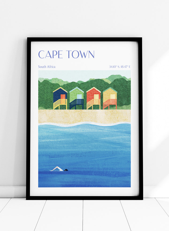 Illustration of beach huts by the sea with 'Cape Town, South Africa' text. Cape Town Beach Huts by Longwayhome is a minimalist coastal art print featuring colorful beach cabins, ocean scenery, and modern travel inspired design.