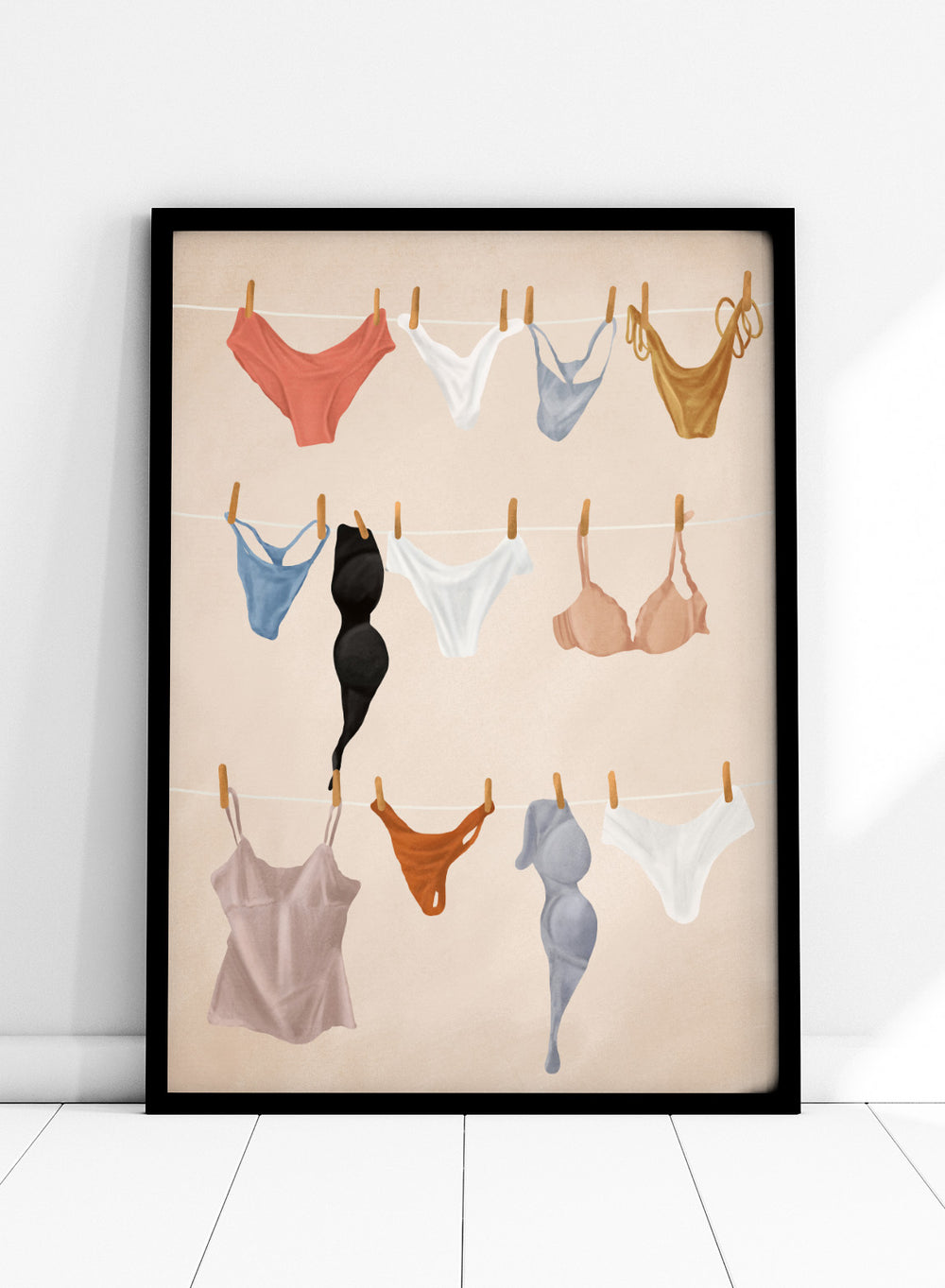 Colorful lingerie hanging on a line against a beige background. Lingerie On The Line by Flow Line is a playful summer art print featuring colorful garments drying in the sun, perfect for bedrooms, dressing rooms, and modern interiors.