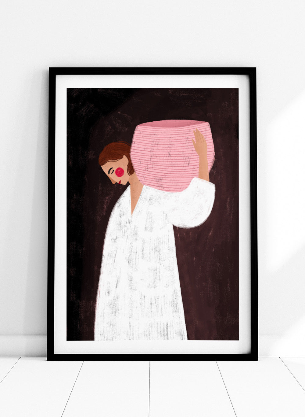 The Woman With the Pink Basket by Bea Müller is an officially licensed art print featuring a modern illustrated figure with soft color contrast and a calm, grounded feel. Available framed or unframed.
