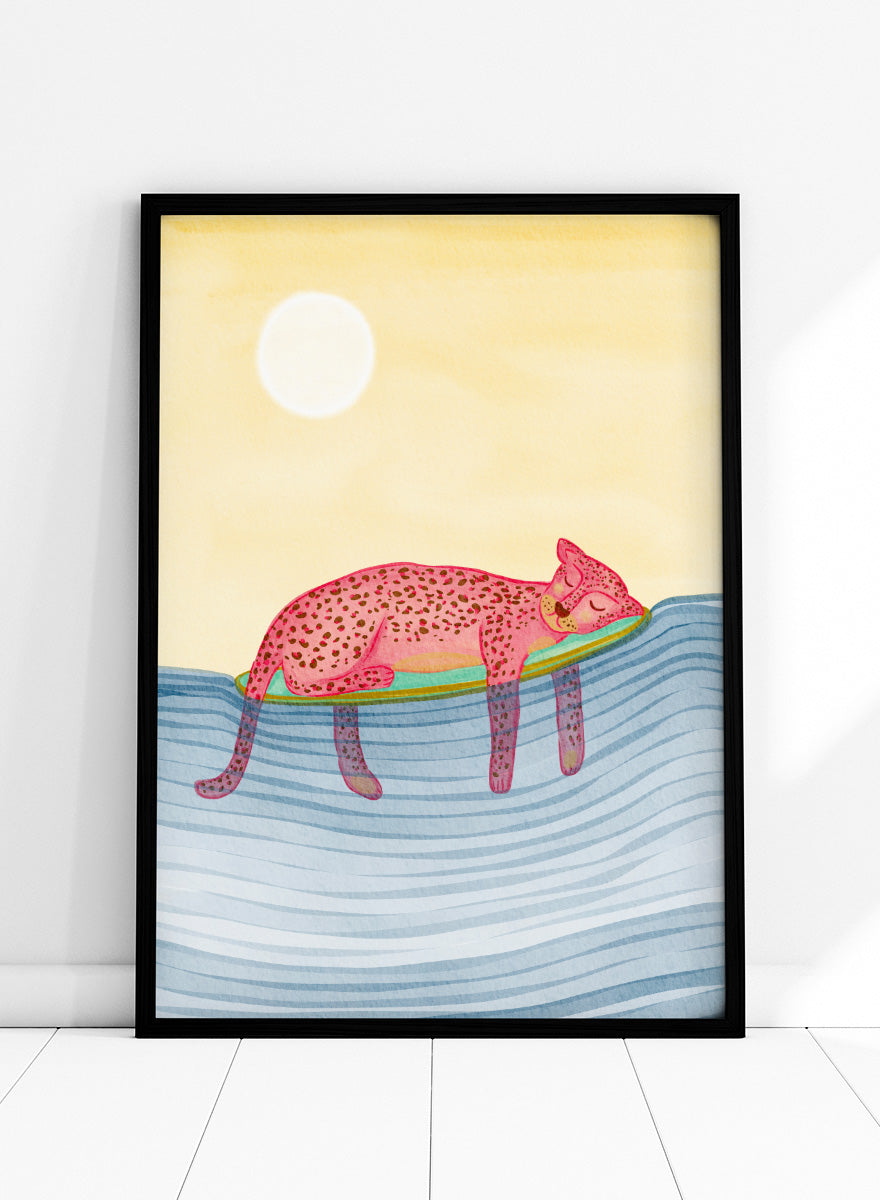 Shop Dreamy Leopard Float by Nikita Jariwala, a playful animal wall art print poster featuring a pink leopard relaxing on a pool float in blue water.