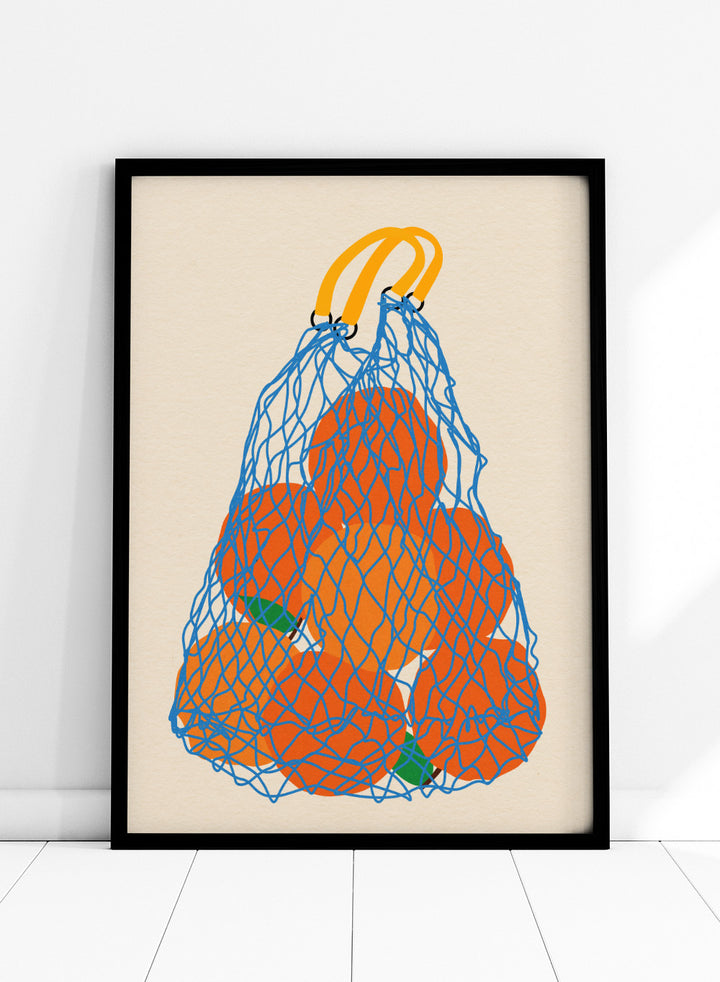 Blue mesh bag filled with orange fruits on a beige background. Oranges In a Net Bag by Rosi Feist is a modern minimalist fruit art print with bold color and Bauhaus-inspired graphic design. Officially licensed fine art poster with framing.