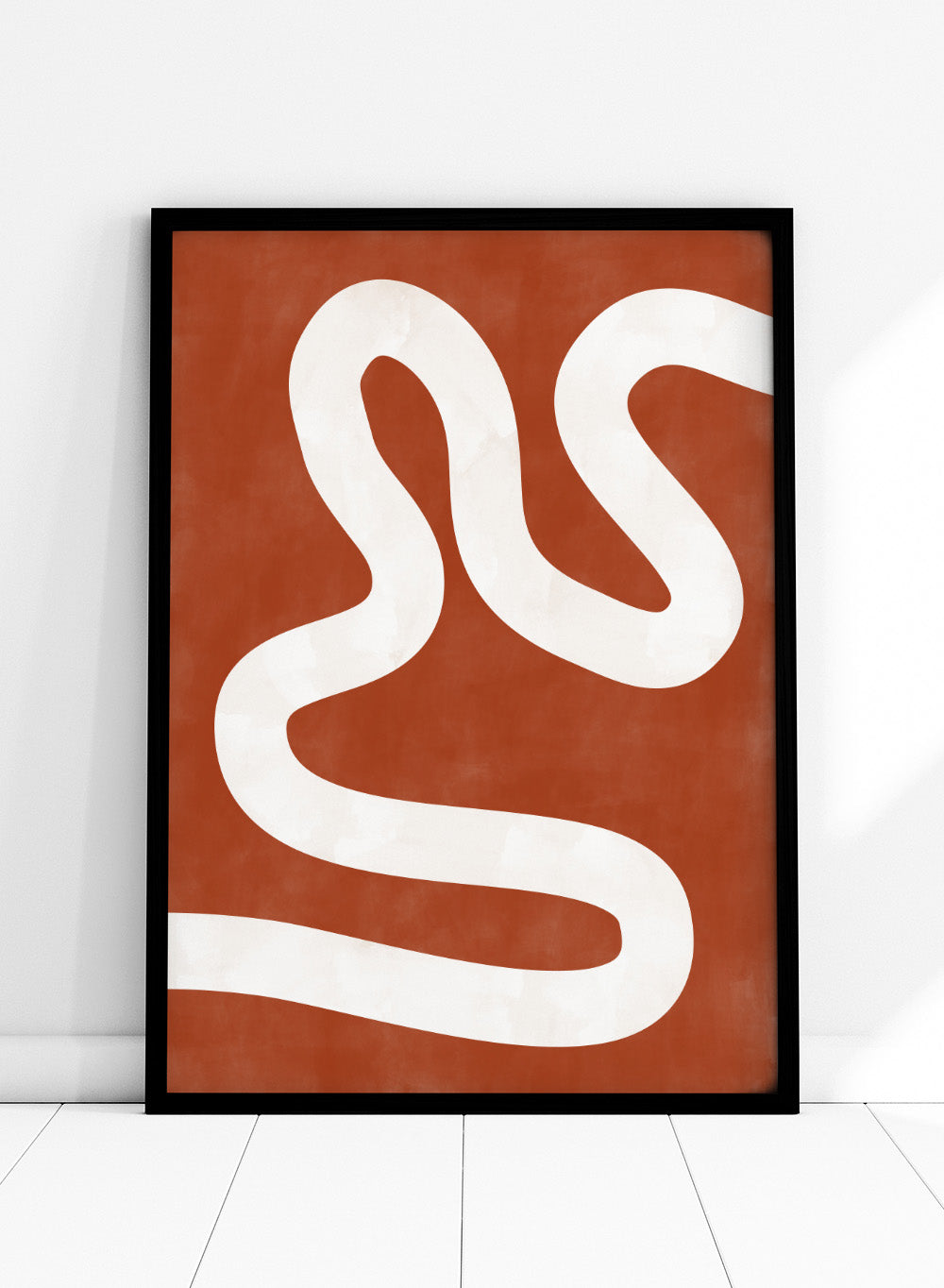 White wavy line on a red background. Crimson Pathways art print by Elena Ristova featuring a flowing white abstract line on a rust red background. Officially licensed modern abstract wall poster.