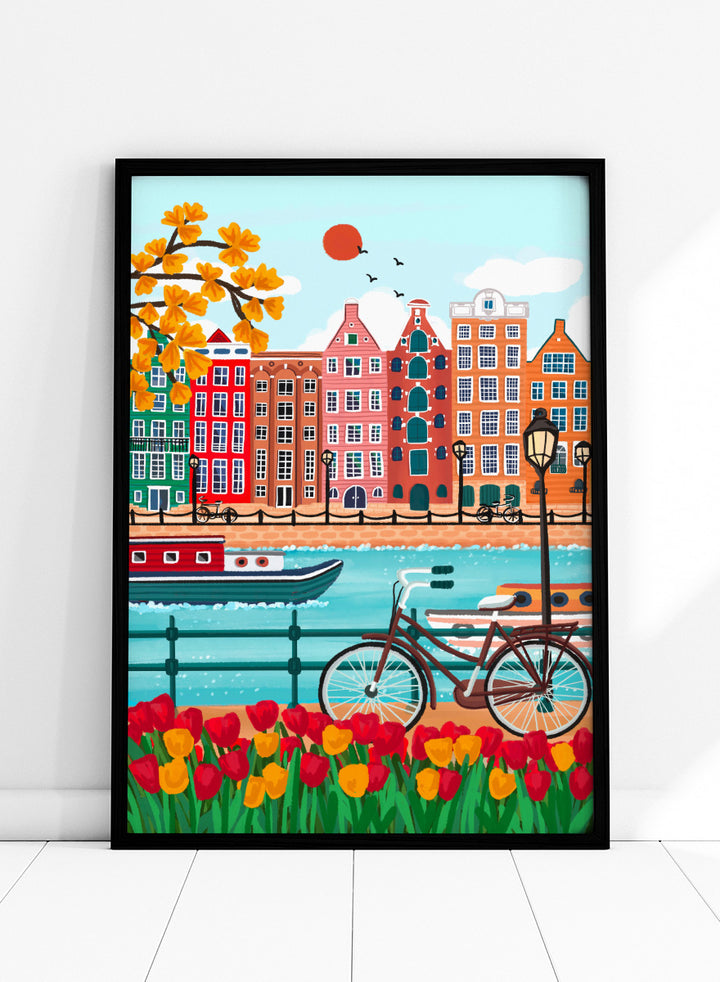 A colorful illustrated city canal scene with row houses, a bicycle, boats, flowers, and a bright sun.  Shop Colorful Amsterdam Canal by Nidhi Kachhadiya, a vibrant Amsterdam wall art print with canal houses, tulips, a bicycle, and colorful city charm.