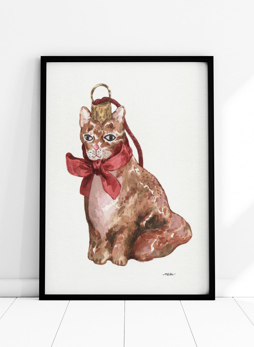 Shop Charming Cat Ornament by NKTN, a festive cat wall art print poster featuring a brown tabby with an oversized red bow and watercolor holiday style.