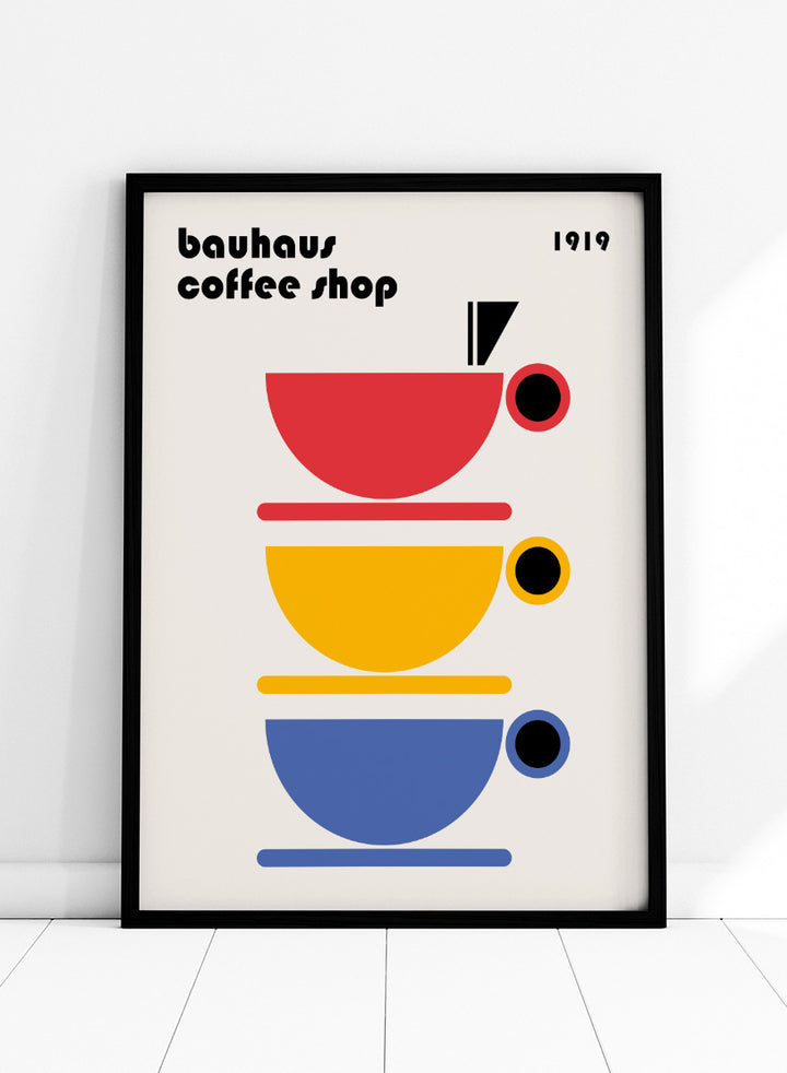 Bauhaus Coffee Cups by Retrodrome kitchen art print featuring stacked red, yellow, and blue coffee cups with bold Bauhaus-inspired design.