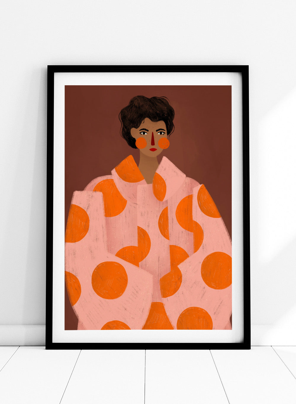 Woman With Orange Dots by Bea Müller is an officially licensed art print featuring a bold modern portrait with graphic color and pattern. Available framed or unframed.