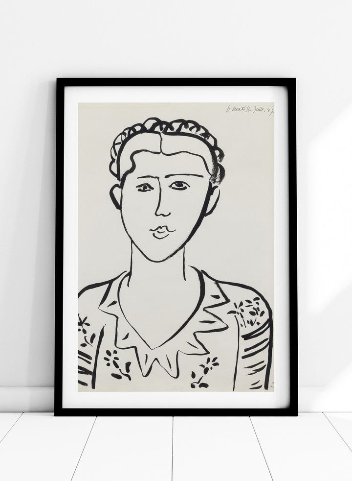 Black line drawing of a woman's portrait on a white background. Portrait de femme by Henri Matisse is a minimalist portrait art print featuring expressive black linework, modern French design, and iconic mid century style.