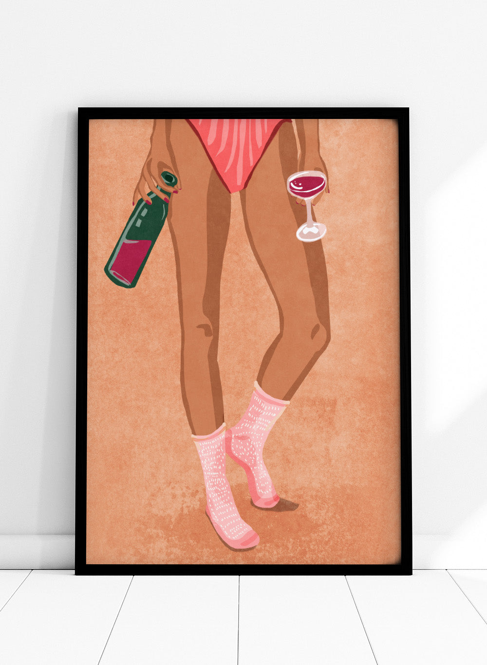 Illustration of a person's legs wearing pink socks with text, holding a bottle and a glass on a peach background. Wine and Socks by Raissa Oltmanns is a modern woman art print featuring wine bottle and glass in bold contemporary wall poster style.