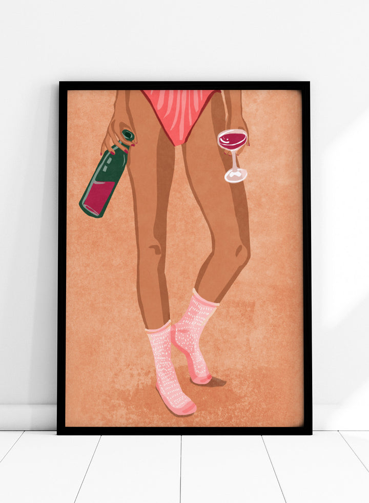 Illustration of a person's legs wearing pink socks with text, holding a bottle and a glass on a peach background. Wine and Socks by Raissa Oltmanns is a modern woman art print featuring wine bottle and glass in bold contemporary wall poster style.