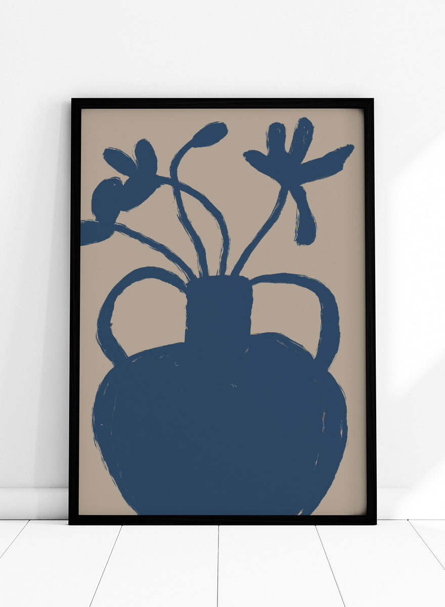 A minimalist art print featuring a dark blue silhouette of a vase with two handles and abstract flower stems, set against a warm beige background. Minimalist Blue Blooms by The Art Concept is a modern floral art print featuring a deep blue vase, loose flowers, and a warm beige background.